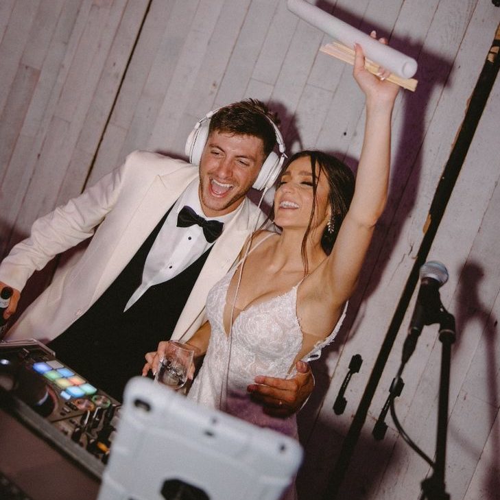 bride and groom at their wedding but also djing and having the best time, dallas texas entertainment, fort worth texas wedding planner