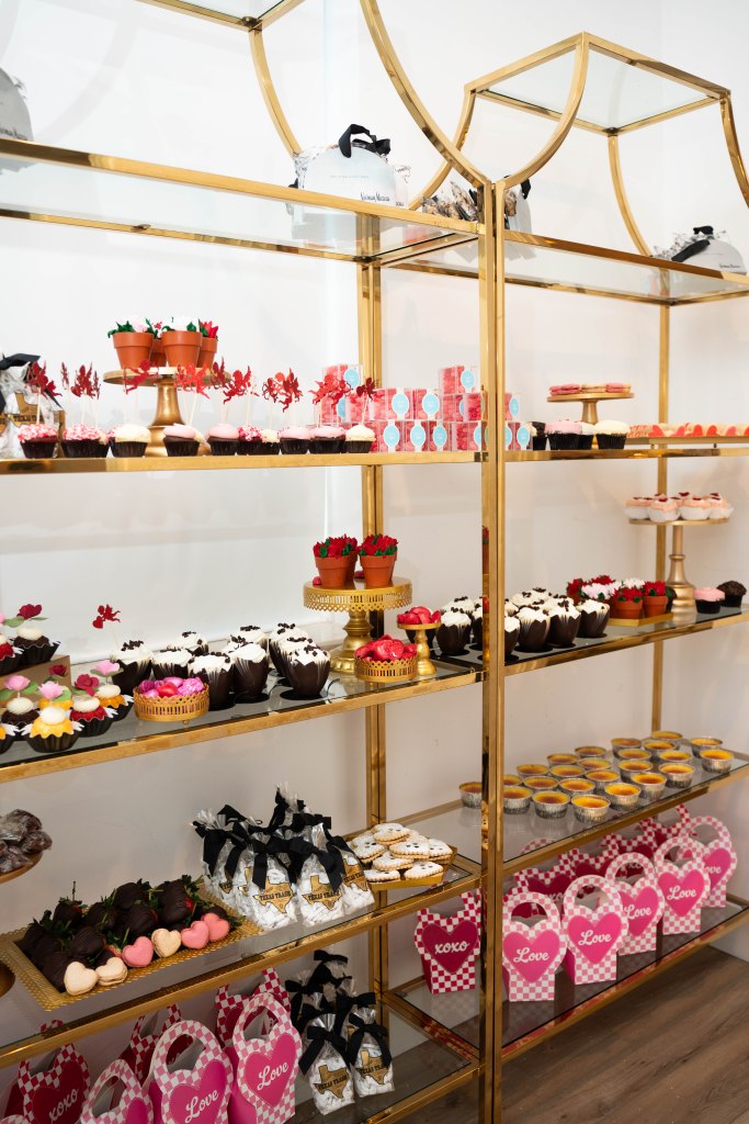 Massive wedding dessert room filled with candy, cookies, and sweet treats
