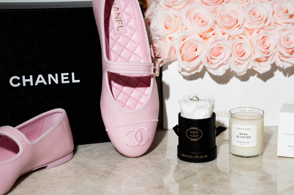 Flatlay featuring Chanel wedding heels and Venus et Fleur preserved roses
