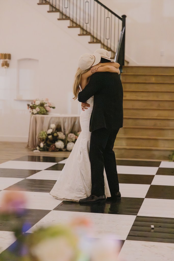 Bride and groom sharing an intimate last dance after their wedding reception with soft lighting, emotional atmosphere, and candid romantic moments.
